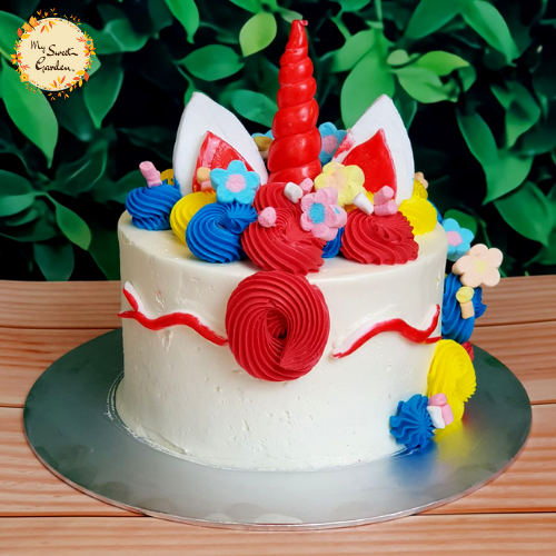 Chelsea Unicorn Artistic Cake with Red Drawn Eyes (Floral Marshmallow, Red, Blue, Yellow)